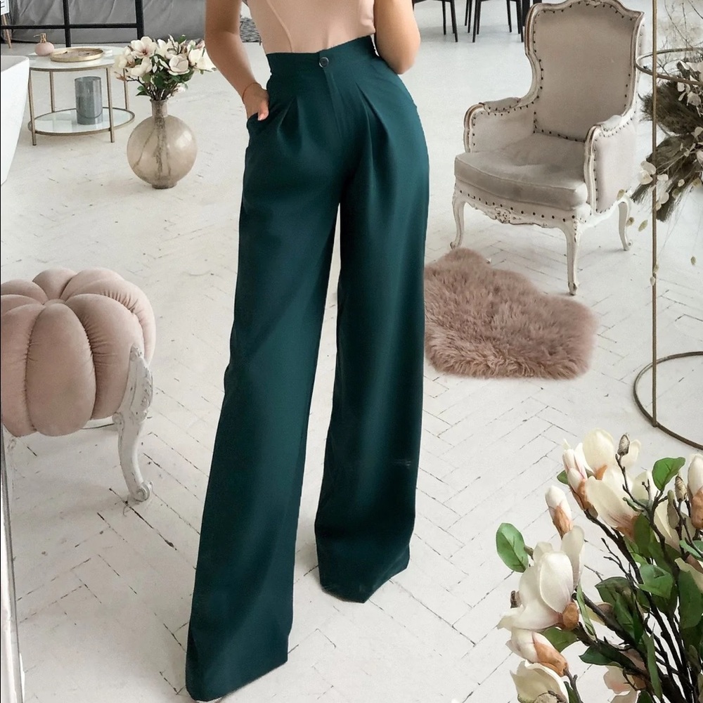 Emerald green high waist pants.